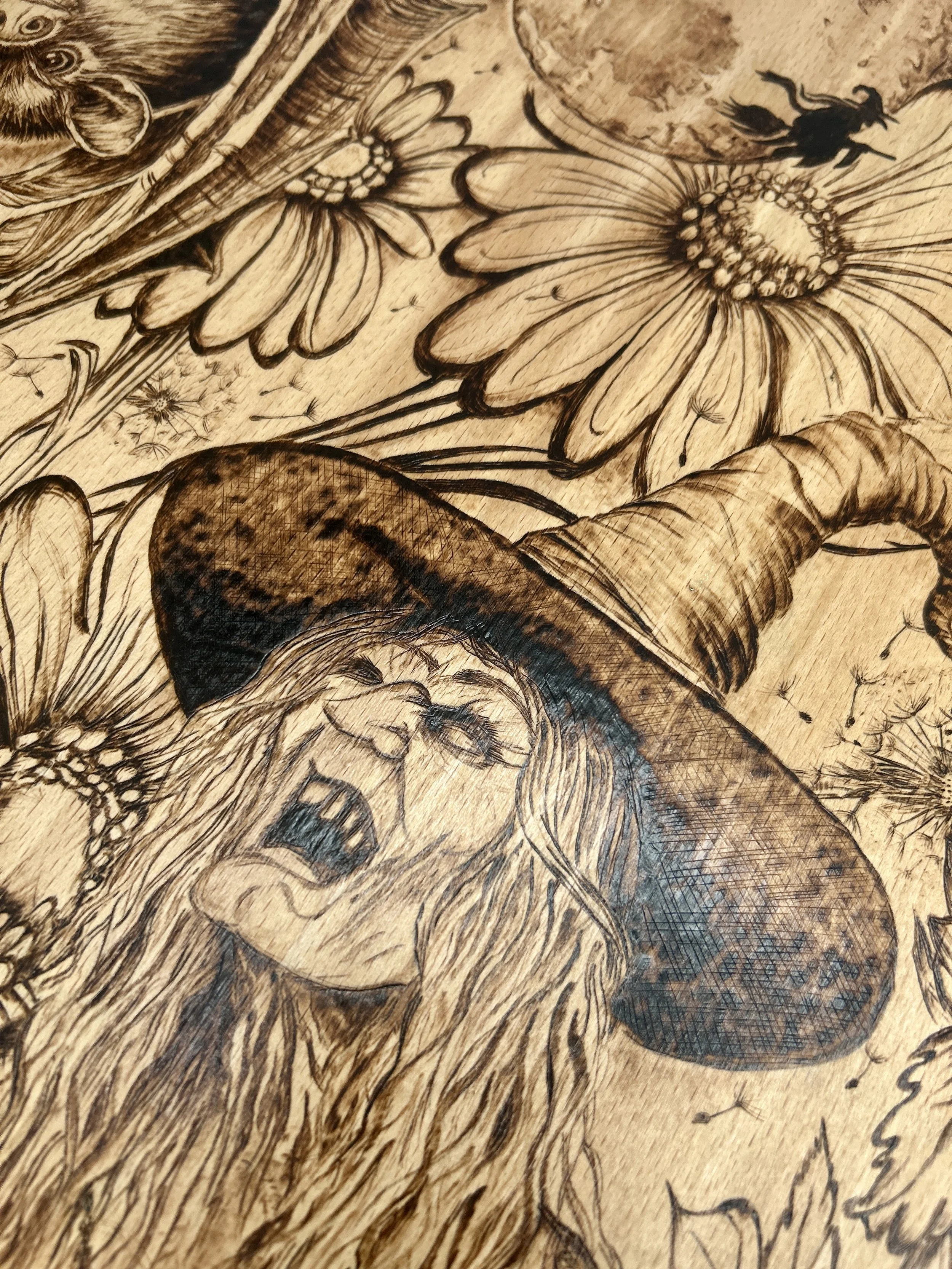 Detailed view of the witch’s face and hat, highlighting the expressive cackling expression and the texture of the pointed hat.