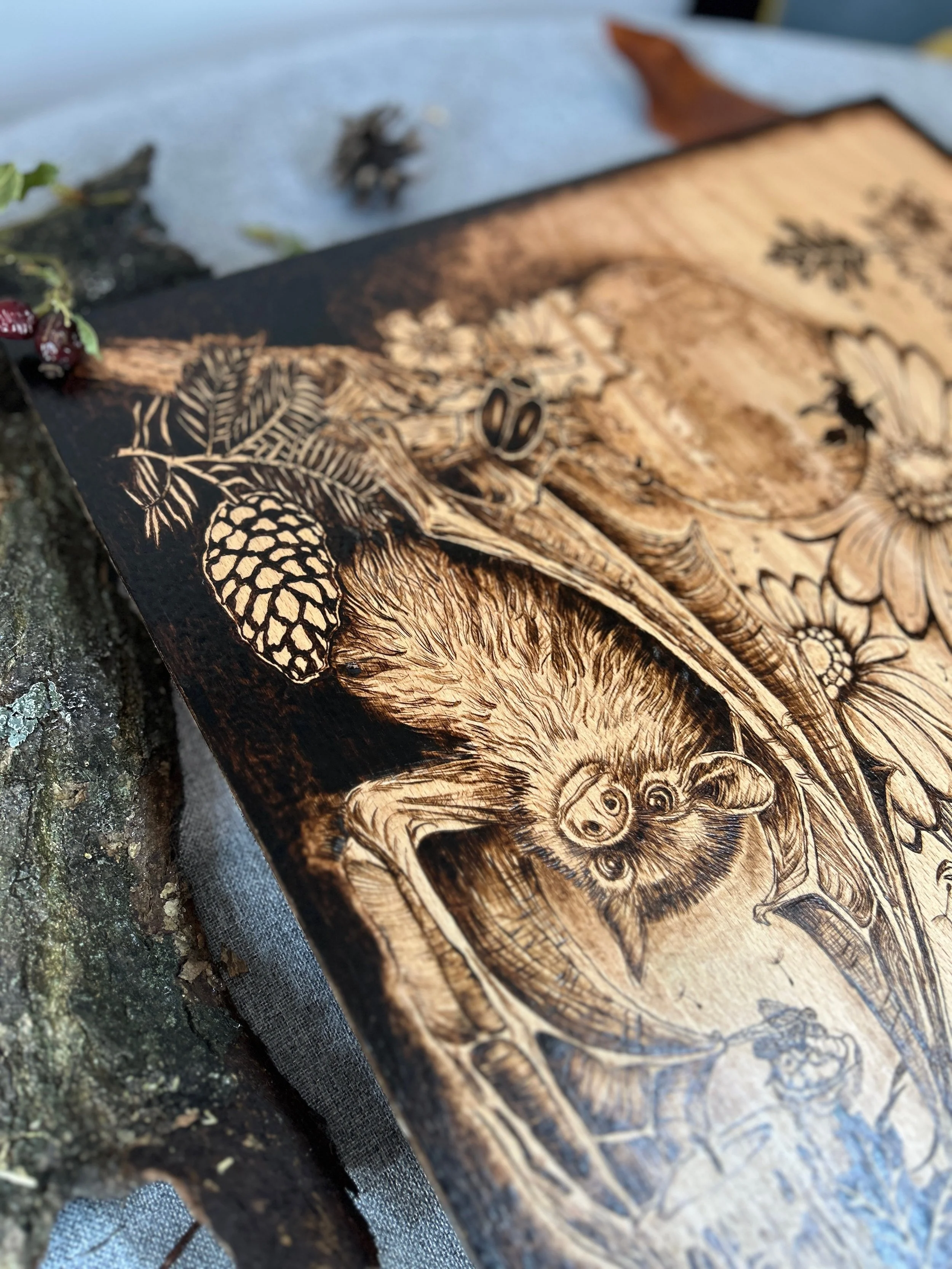 Close-up of ribbed pumpkin skin and etched skull bones in The Darkest Wishes pyrography on solid hardwood timber.