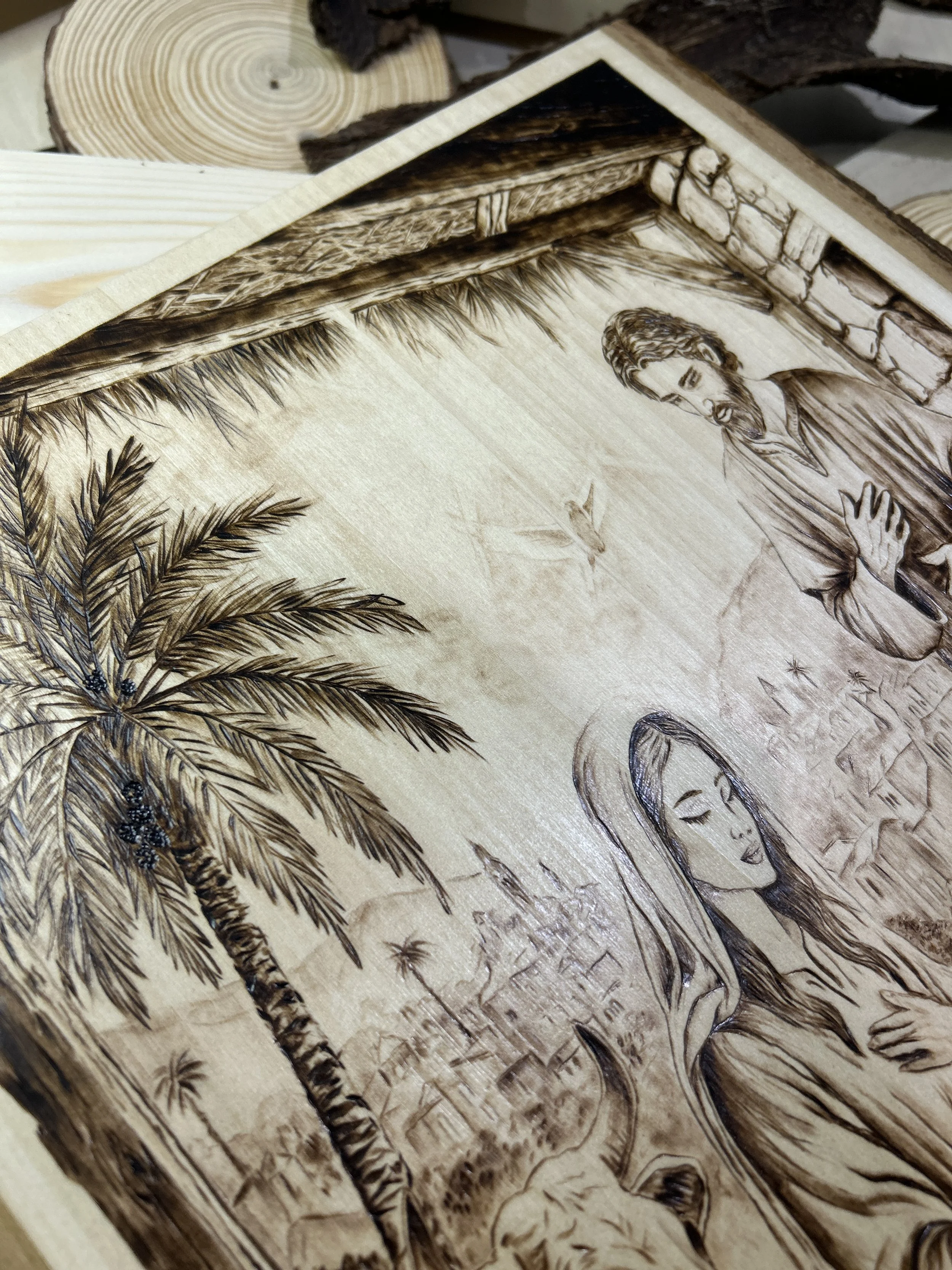 Wood-burned pyrography artworks, handcrafted fantasy art in unique, artisan, one-of-a-kind designs and decor, detailed nativity scenes on natural wood, religious festive Christmas themes