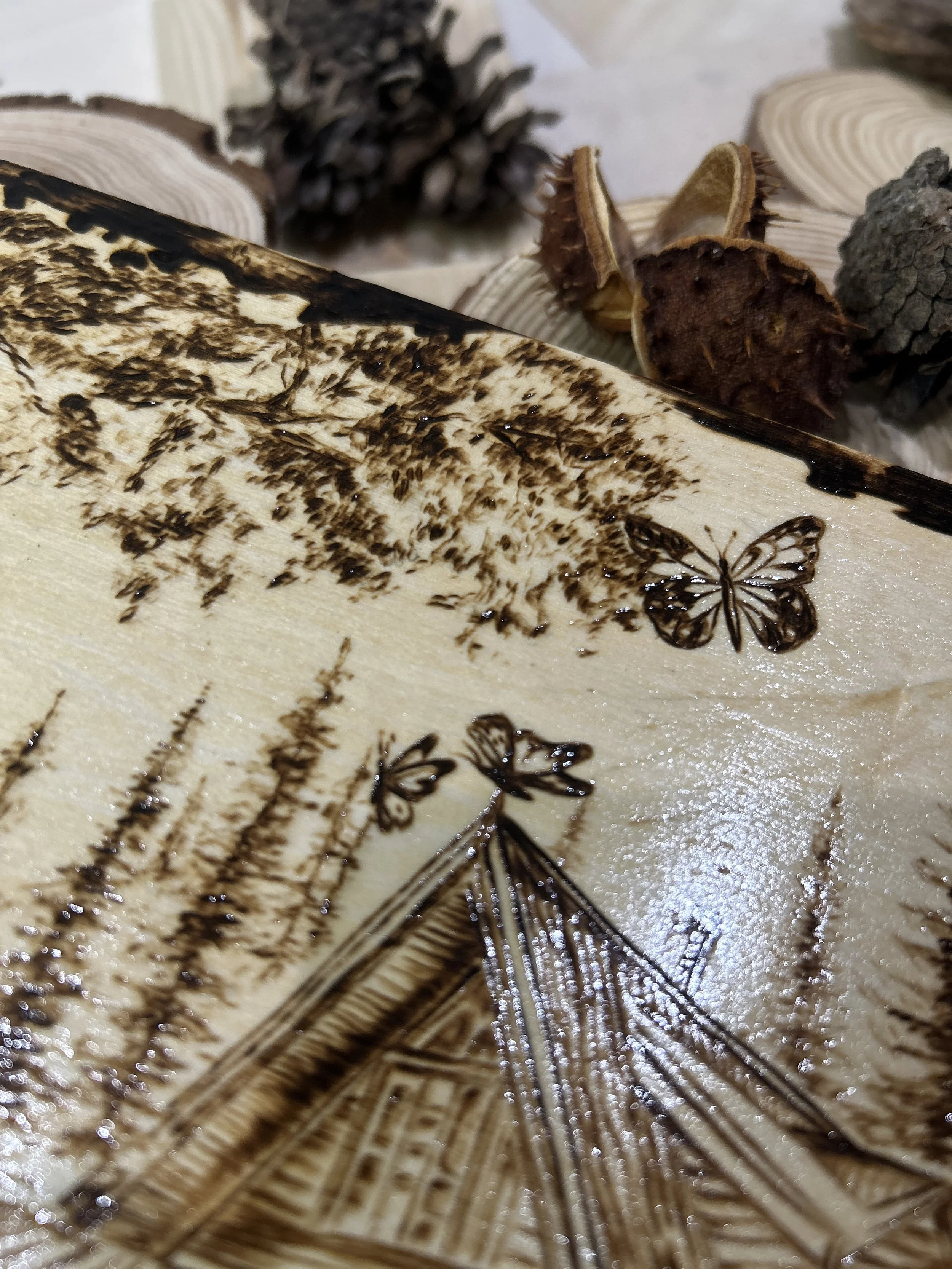 Collection of wood-burned pyrography artworks showcasing handcrafted fantasy art in unique, artisan, one-of-a-kind designs and decor, featuring detailed Dusk Hollow scenes on natural wood