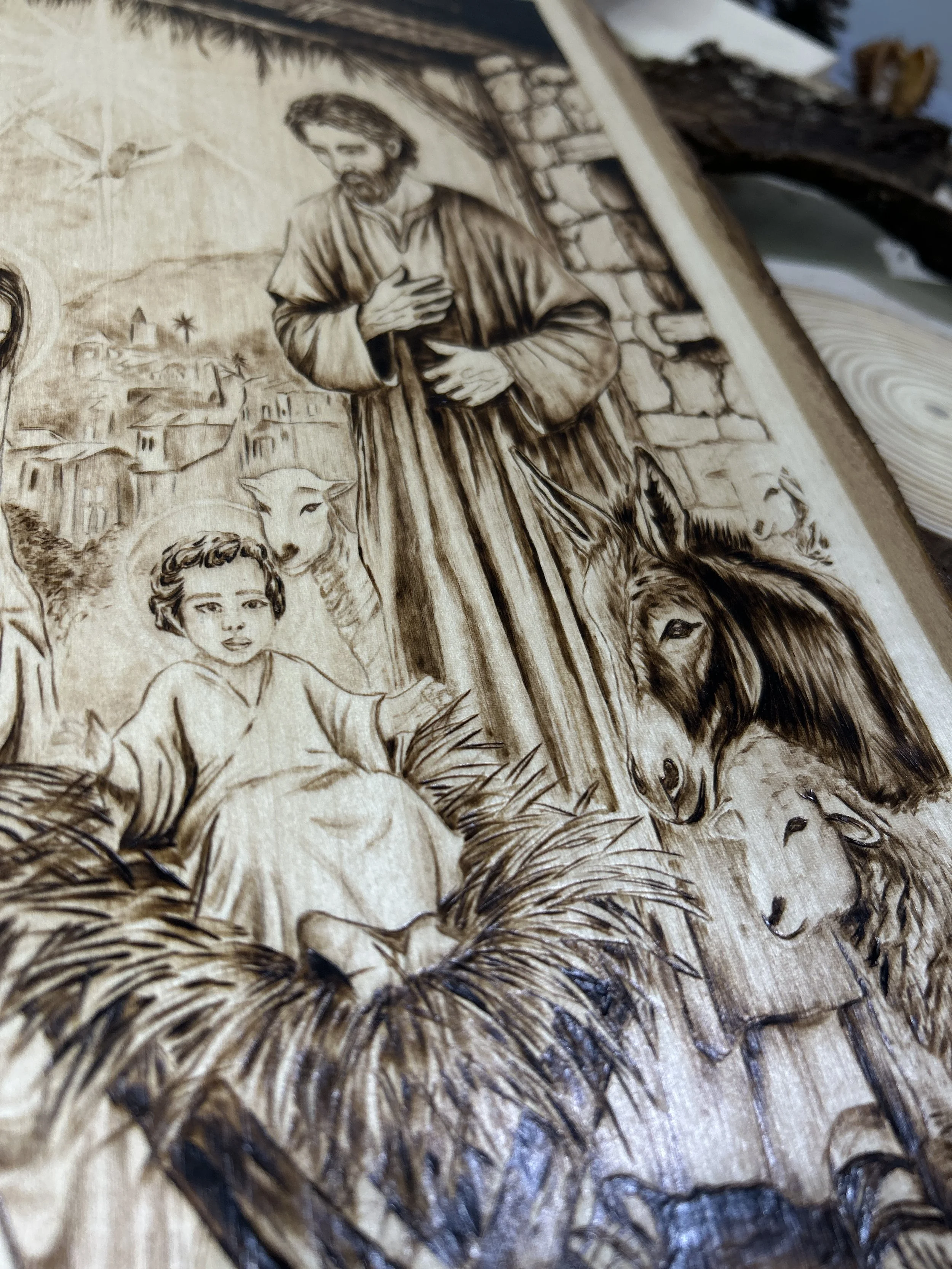 Wood-burned pyrography artworks, handcrafted fantasy art in unique, artisan, one-of-a-kind designs and decor, detailed nativity scenes on natural wood, religious festive Christmas themes