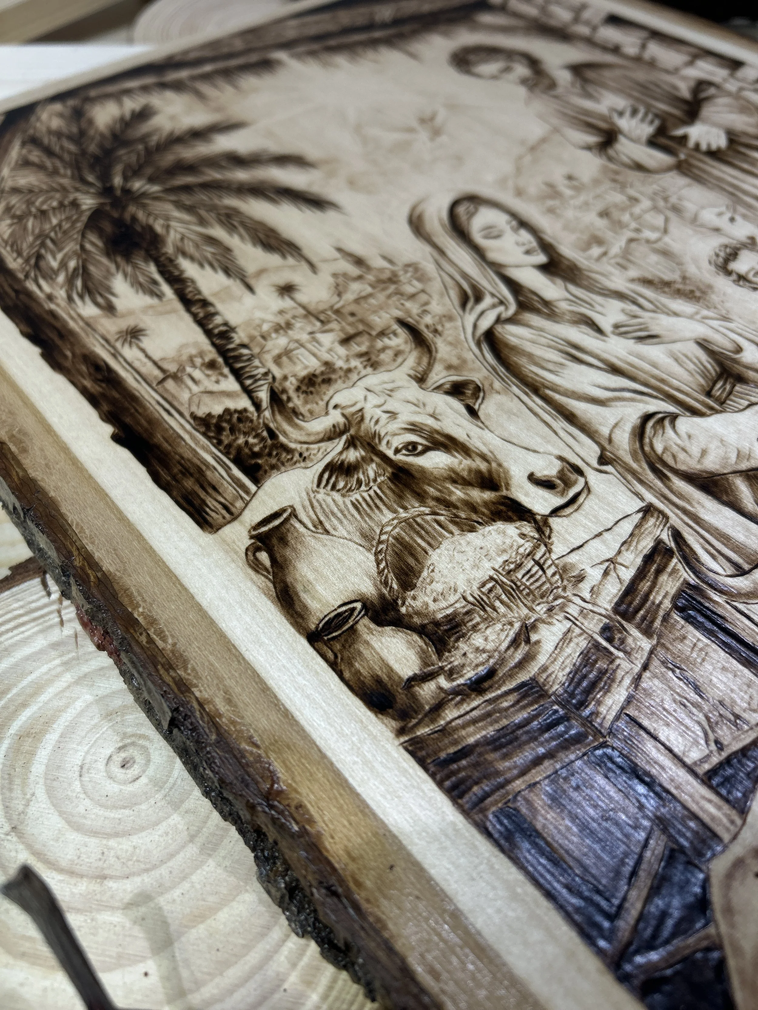 Wood-burned pyrography artworks, handcrafted fantasy art in unique, artisan, one-of-a-kind designs and decor, detailed nativity scenes on natural wood, religious festive Christmas themes