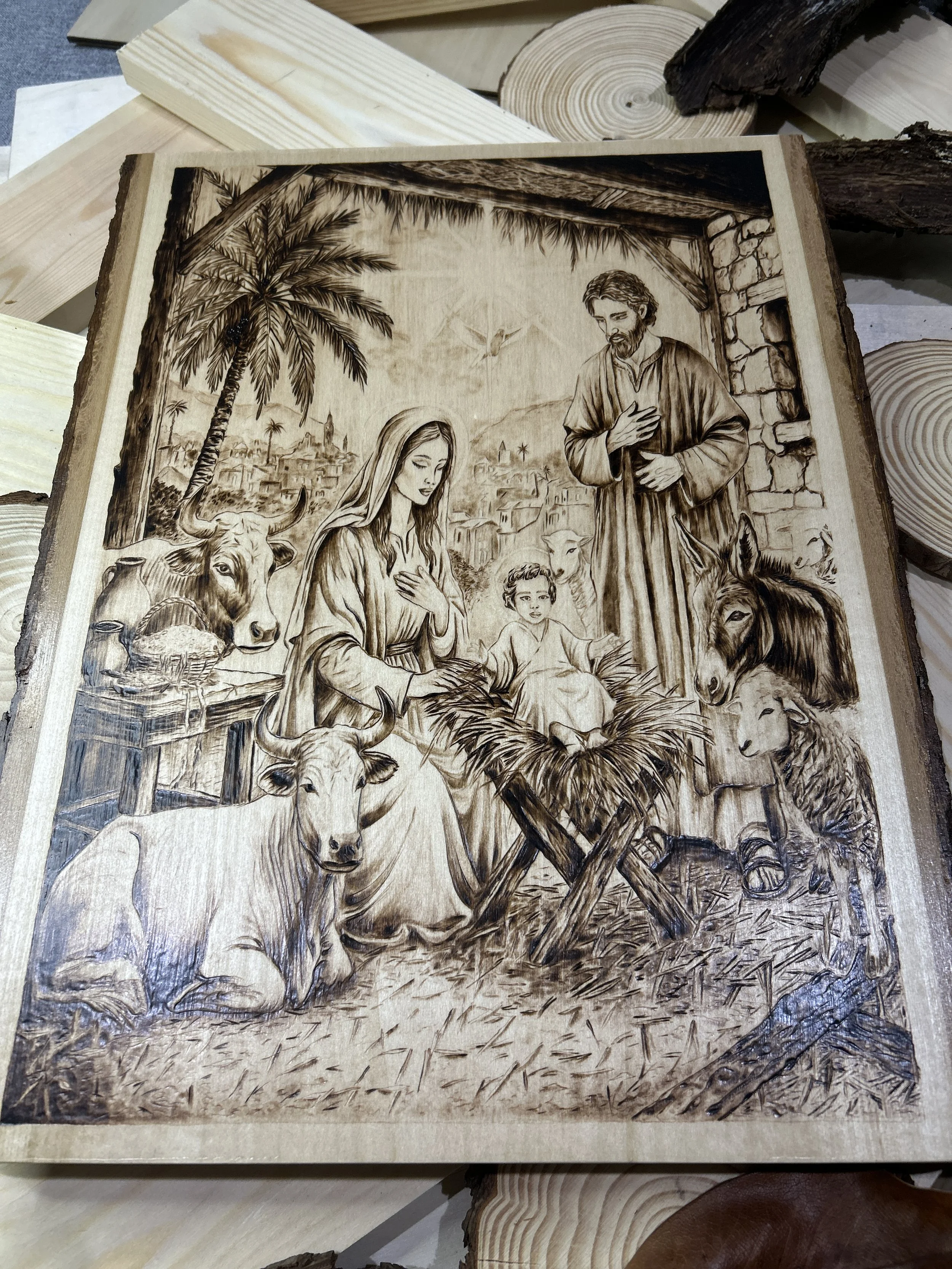 Wood-burned pyrography artworks, handcrafted fantasy art in unique, artisan, one-of-a-kind designs and decor, detailed nativity scenes on natural wood, religious festive Christmas themes