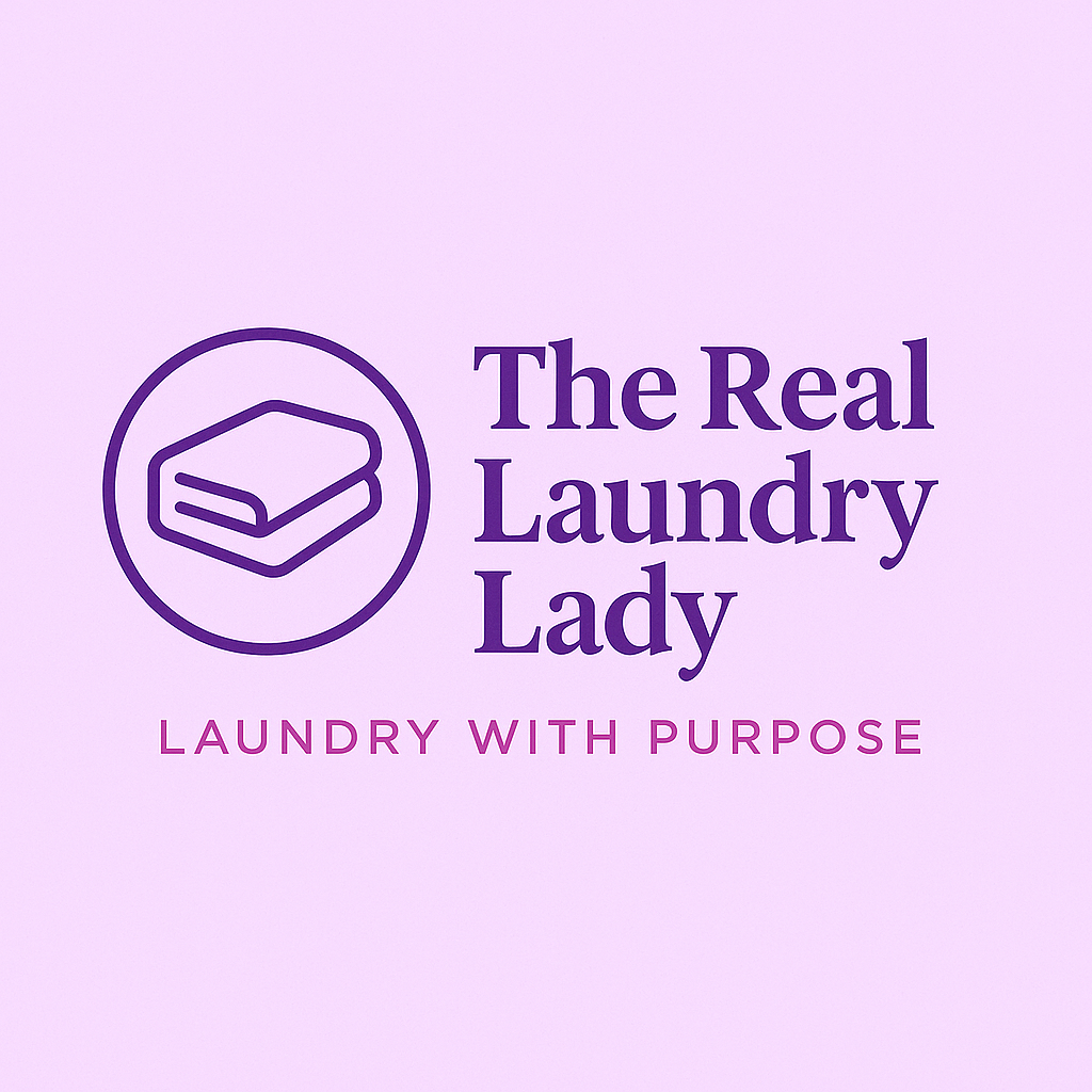 Logo of The Real Laundry Lady with a washing machine symbol and the slogan 'Laundry with Purpose' in purple text on a light purple background.