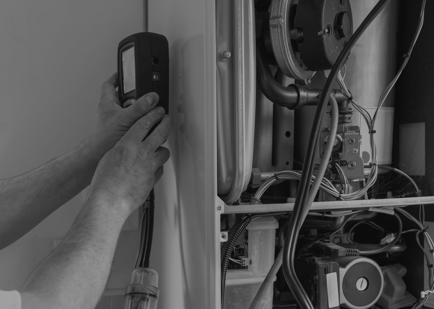 Engineer servicing a commercial boiler