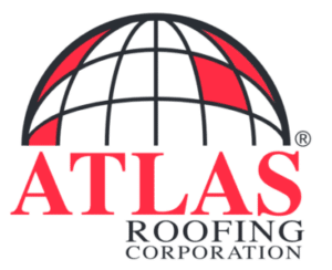 A woman with short blonde hair sitting on a beige bench, writing in a notebook. She is wearing an orange sleeveless top and beige pants, with a large houseplant and modern art piece in the background, lit by natural light.