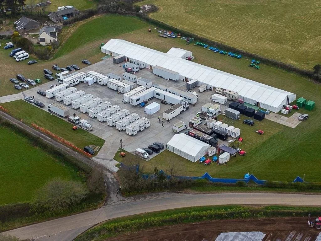 Oranssi technician working on a roof project