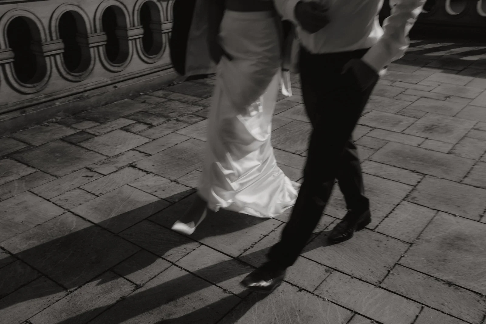 editorial wedding couple walking together in an evening setting