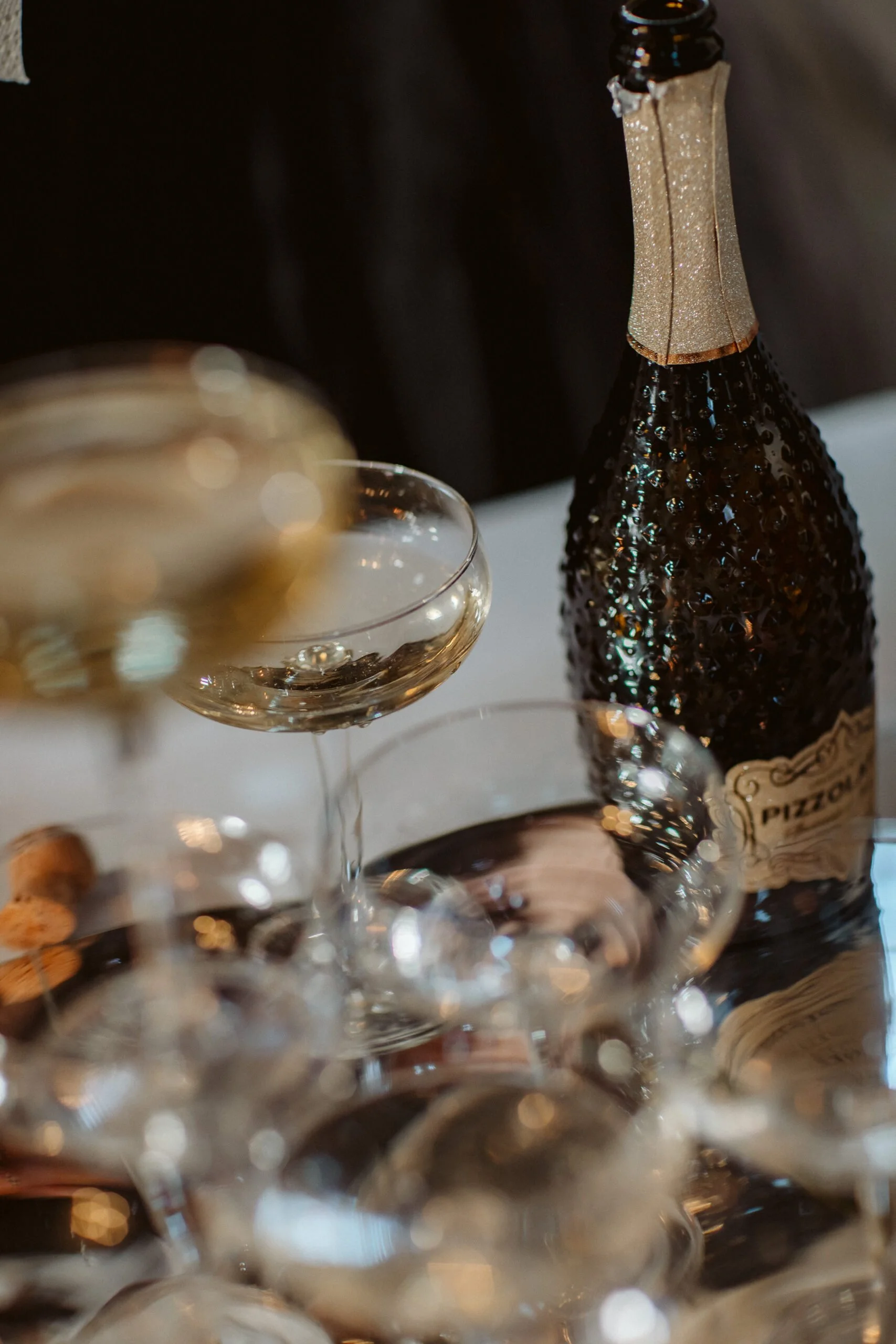 luxury wedding table with champagne bottles and elegant glassware