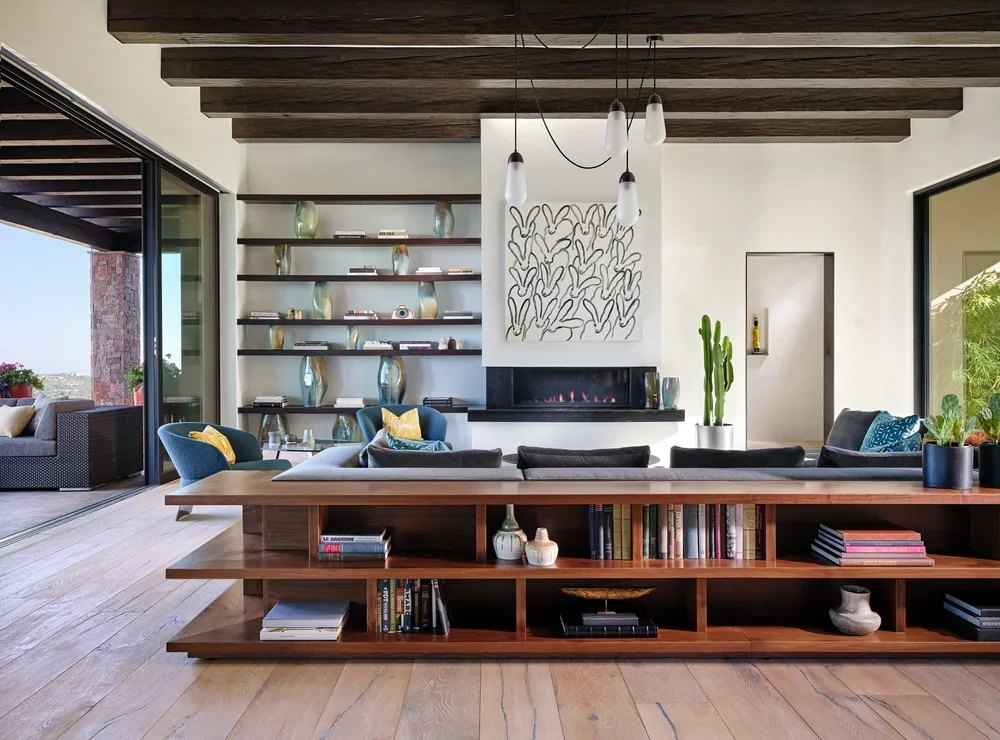 Modern Open Living Room with Custom Shelving by Chandler Prewitt Design