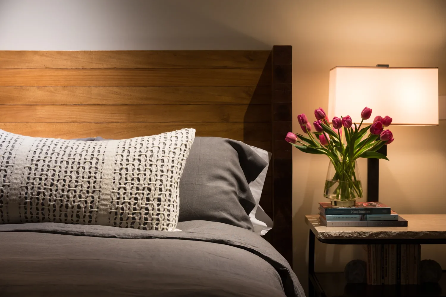 Modern Bedroom with Wood Headboard and Bedside Tulips (Copy)