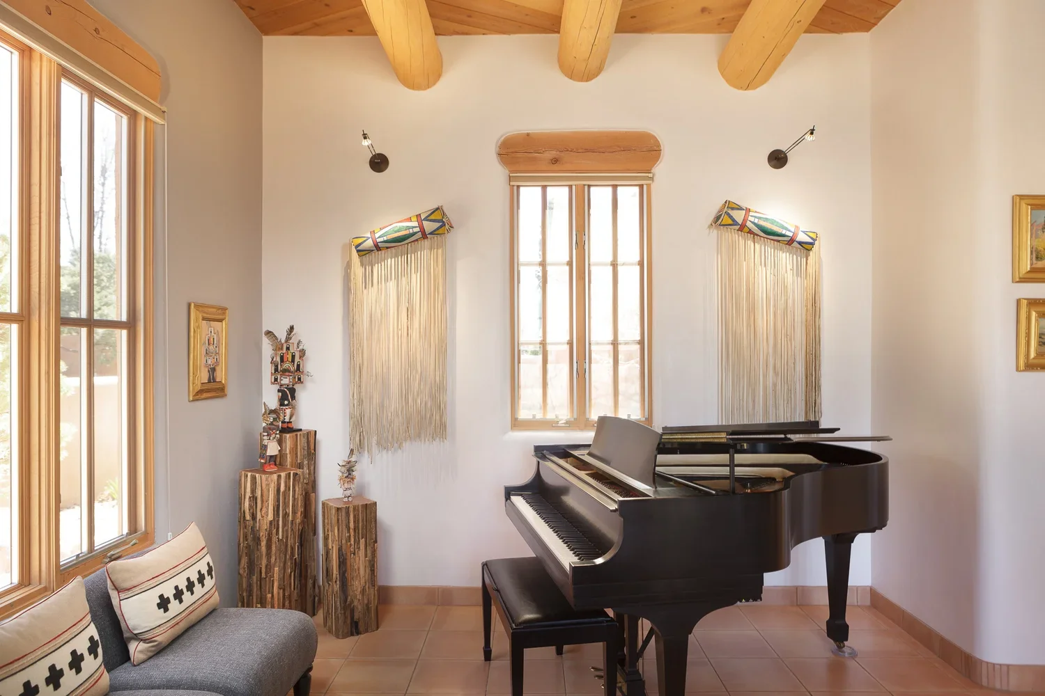 Sunlit Music Room with Grand Piano and Exposed Wood Beams