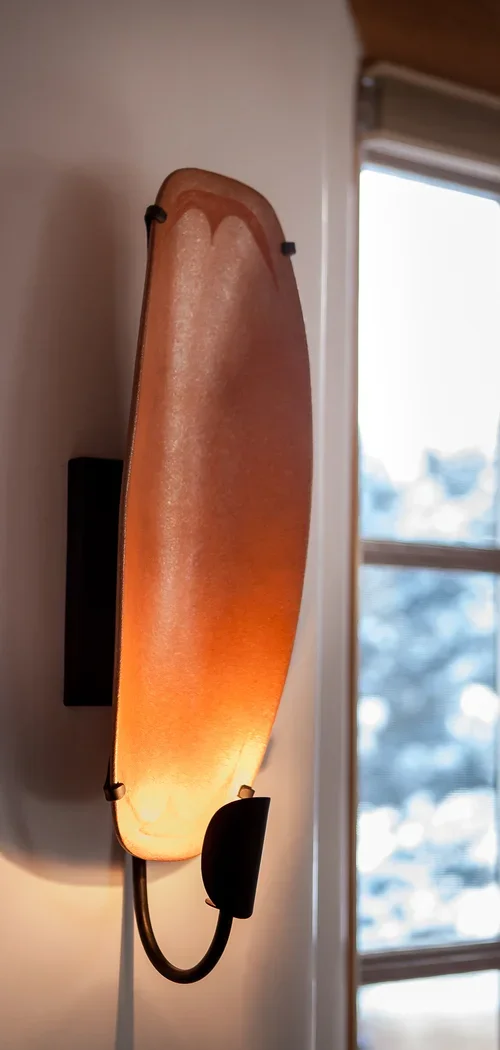 Handcrafted Copper Wall Sconce with Warm Ambient Lighting