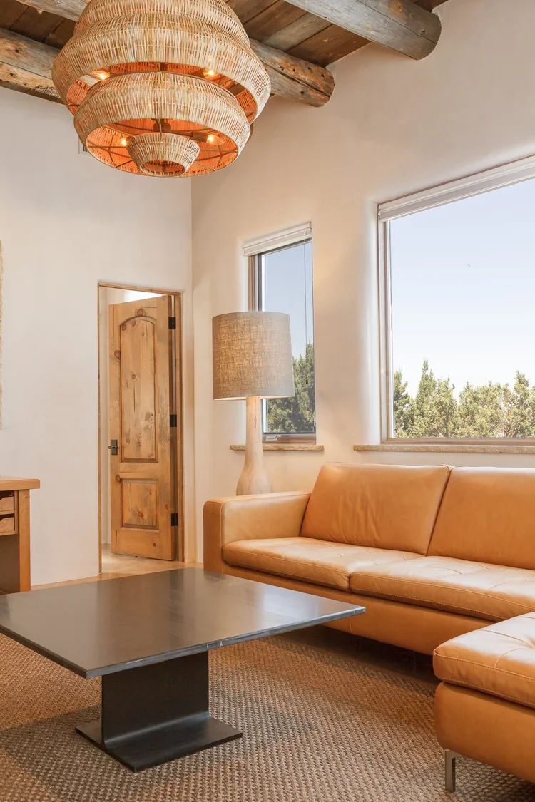 Modern Living Room with Curved Sofa and Sculptural Pendant Light
