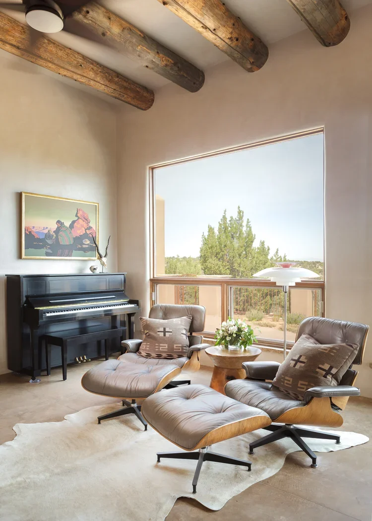 Sunlit Living Room with Piano and Exposed Wood Beams