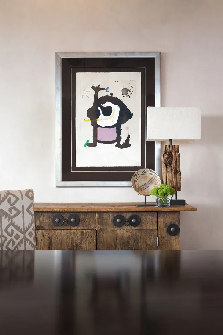 Console Table with Abstract Artwork and Table Lamp