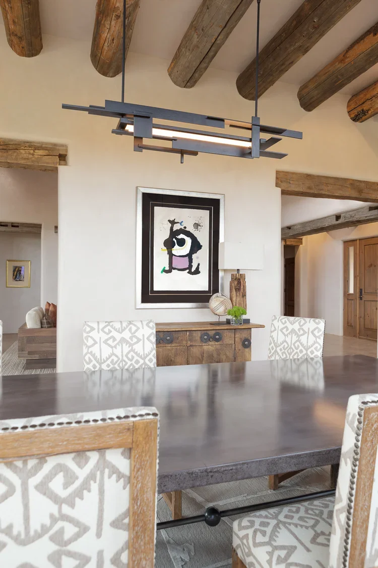 Open Living Space with Exposed Beams and Stone Fireplace