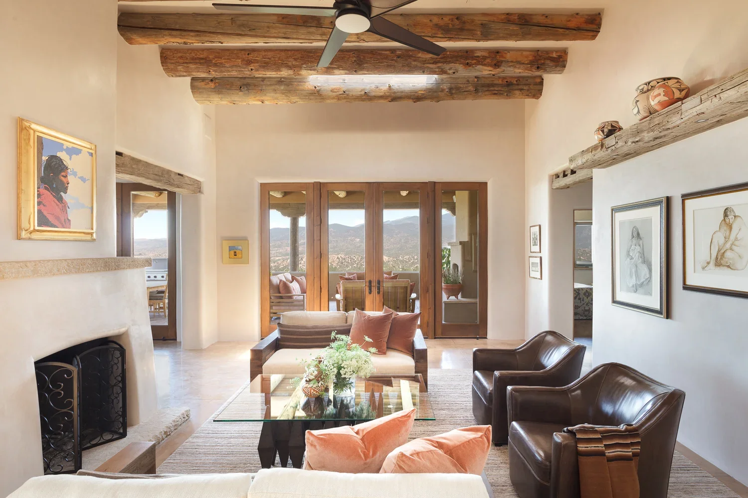 Southwestern Living Room with Exposed Beams and French Doors