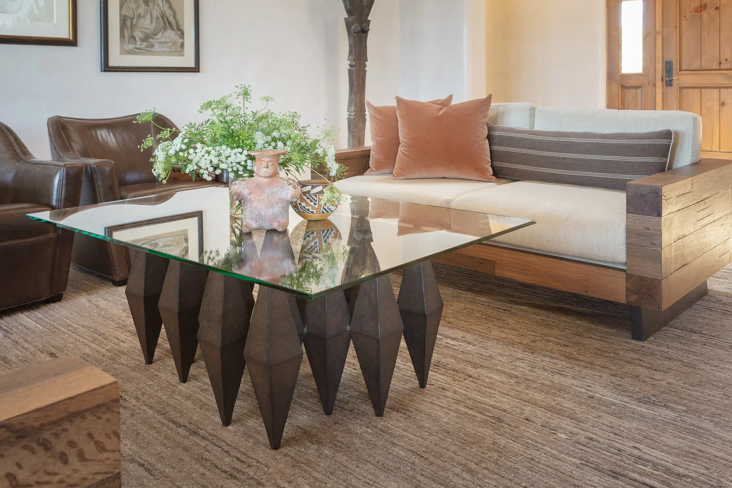 Modern Coffee Table with Sculptural Base and Floral Arrangement