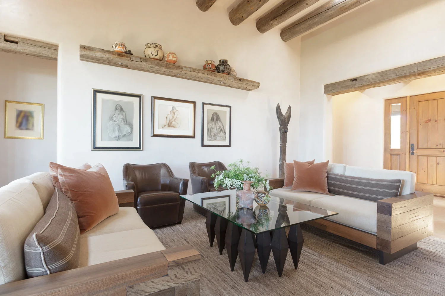 Southwestern Living Room with Leather Chairs and Terracotta Accents