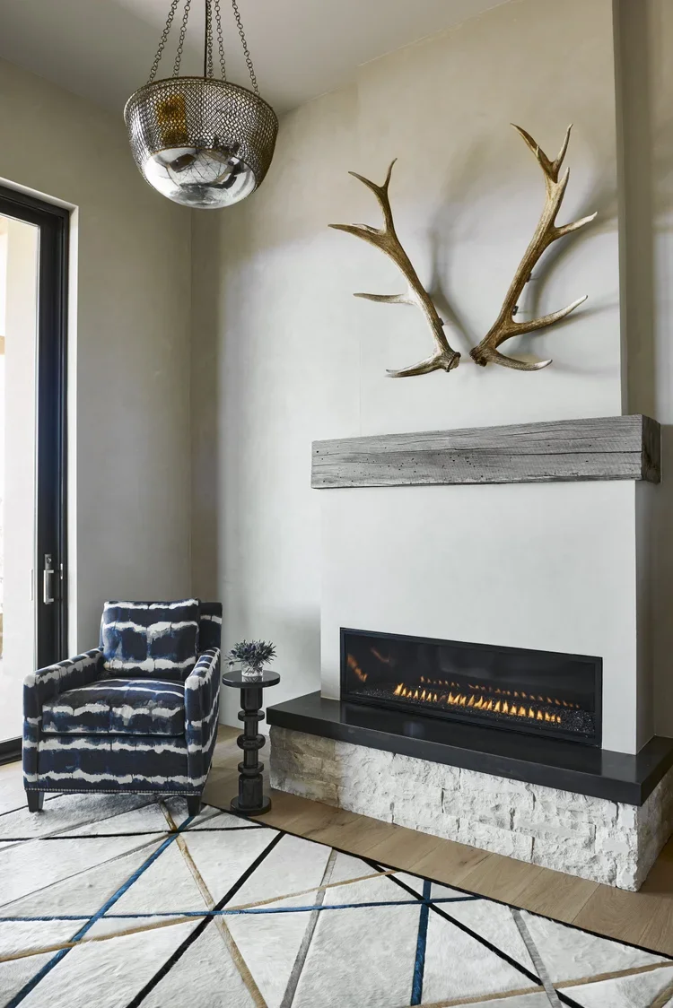 Modern Fireplace with Antler Wall Decor and Floating Mantel