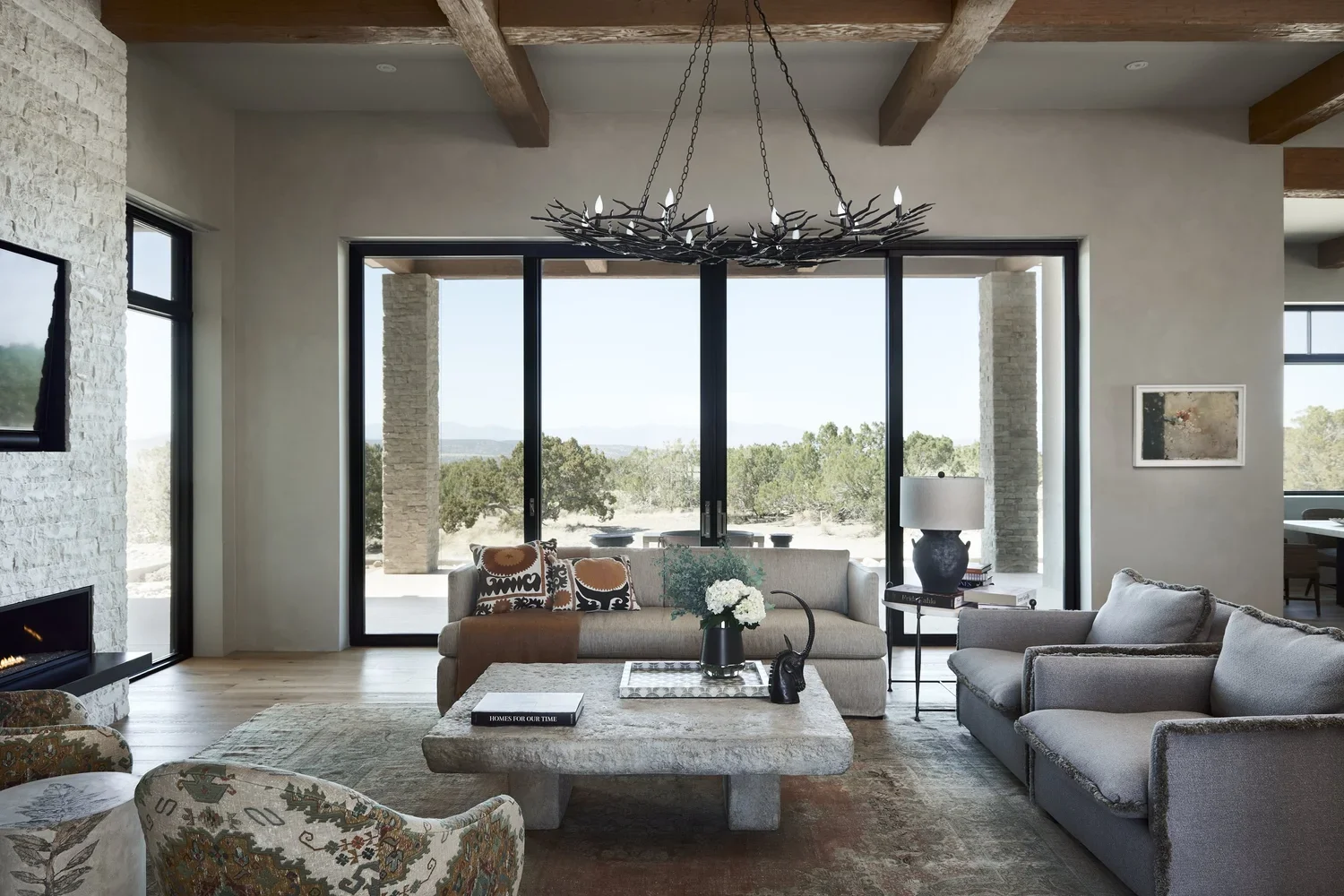 Open Living Room with Panoramic Sliding Glass Doors and Mountain Views