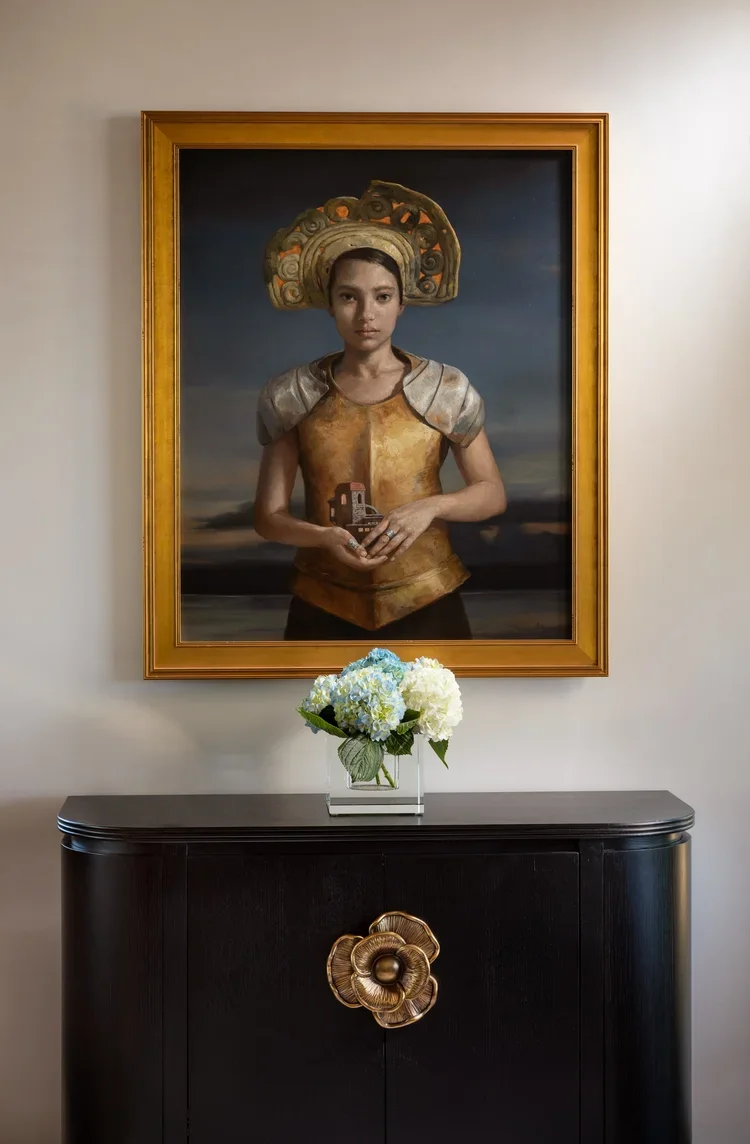 Classic Portrait Artwork Above Antique Cabinet