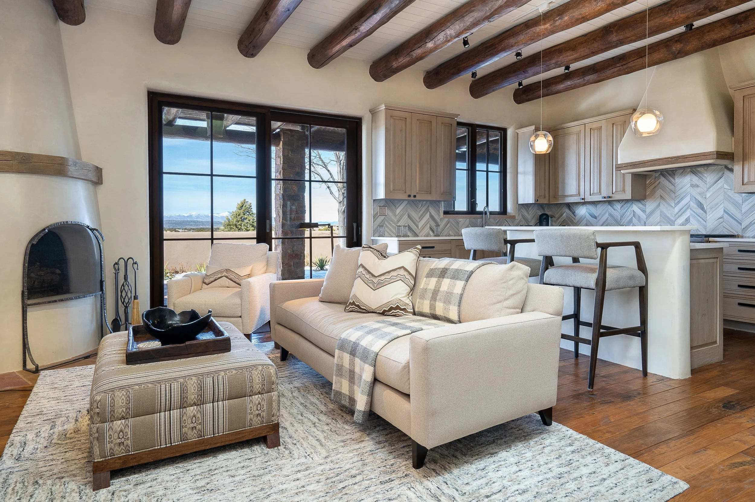 Open Concept Living Room and Kitchen with Exposed Wood Beams
