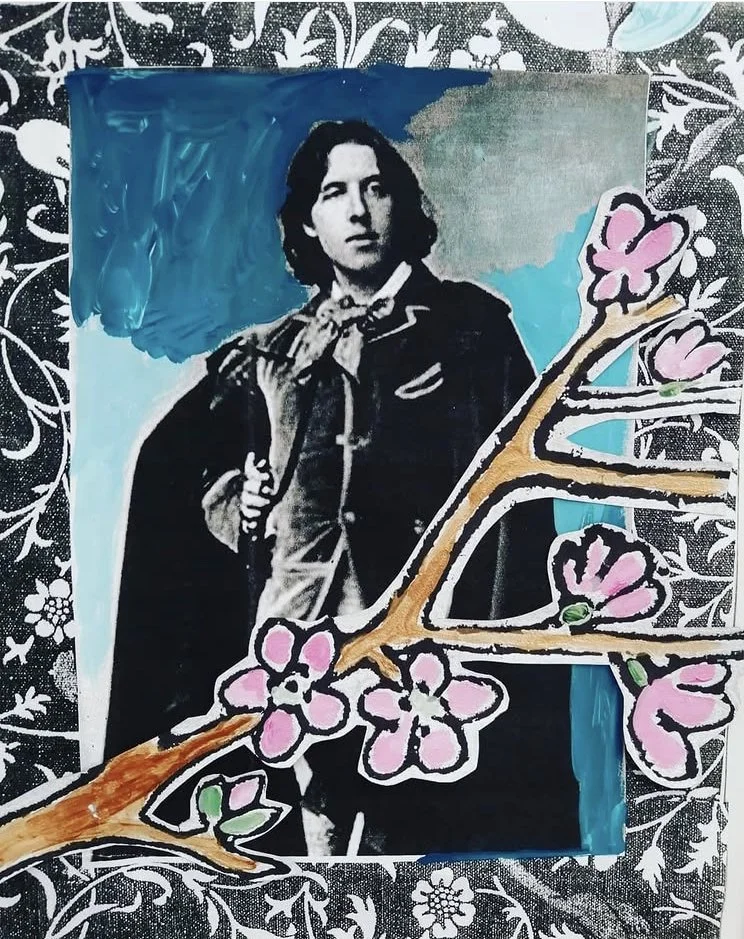 Mixed media collage featuring a black and white photograph of a woman with dark hair, holding a book, overlaid with painted pink flowers on a brown branch and a blue background, all on a patterned black and white floral backdrop.