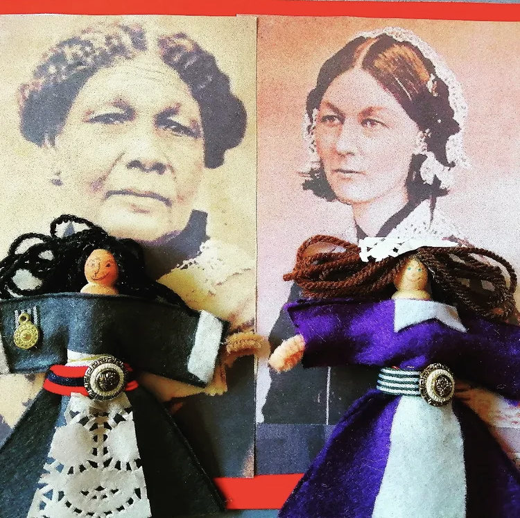 Two vintage-style portrait prints of women with styled hair, positioned side by side. In front of each portrait, there are handmade dolls dressed in historically inspired clothing.