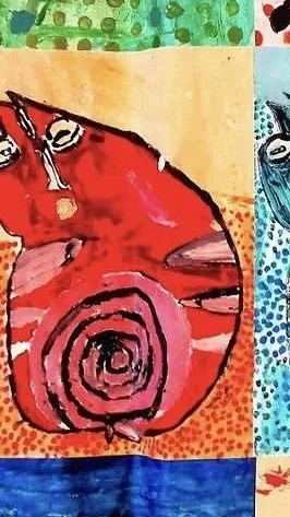 A colorful, abstract painting featuring a red cat with a spiral tail on a patchwork background of various patterns and colors.