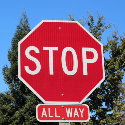 Red octagonal stop sign with white border and white letters, with an additional rectangular sign below reading "ALL WAY."