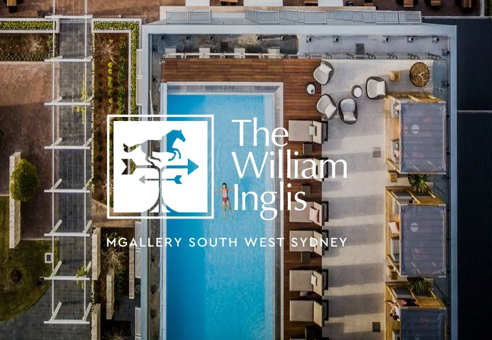 A rooftop swimming pool with surrounding seating and lounge chairs, overlooking a garden area in South West Sydney.