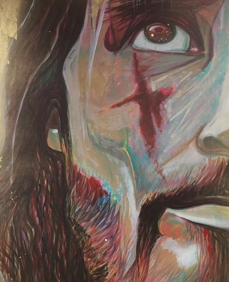 Close-up painting of a person's face with a large eye, dark hair, and a bloody cross on the forehead and cheek, with part of the lips and nose visible.