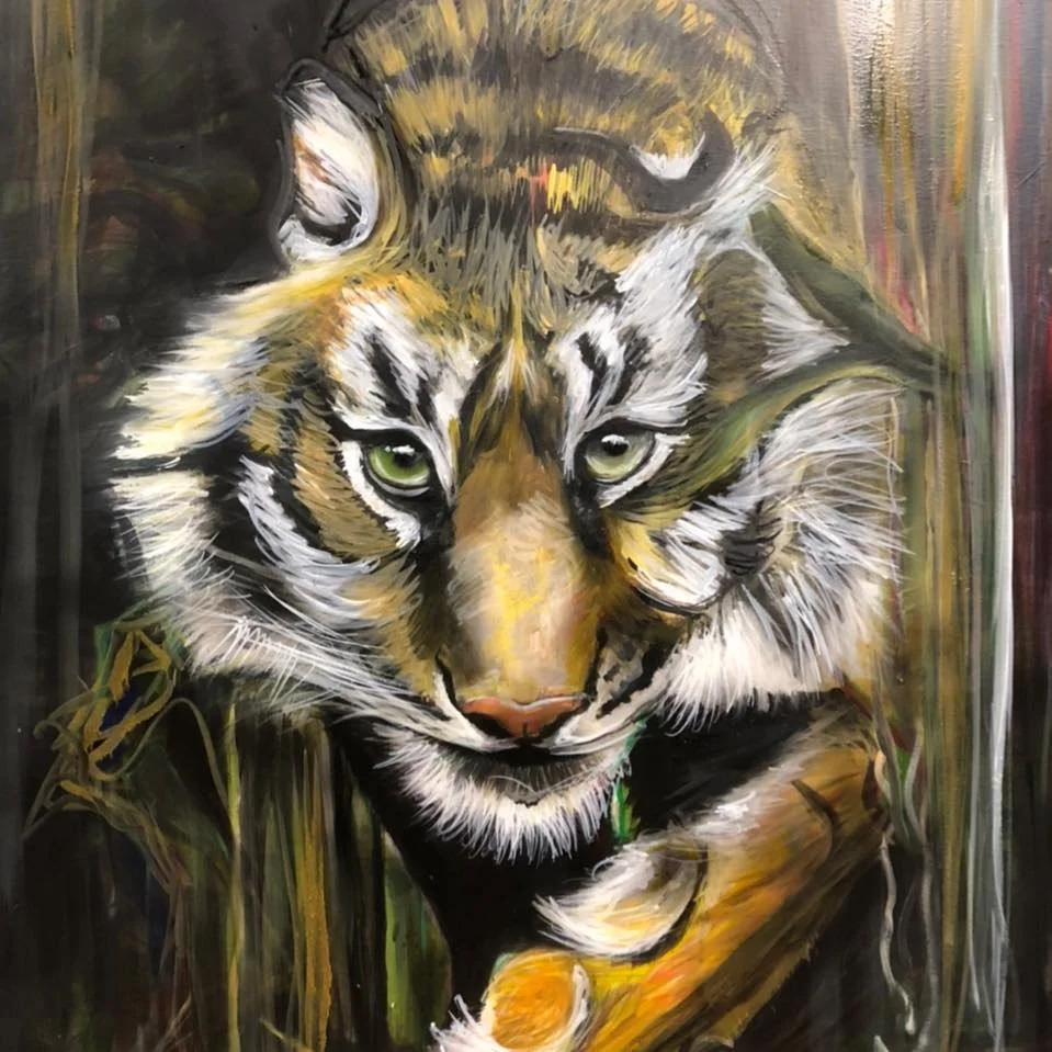 Close-up of a tiger's face with vivid green eyes, painted in an expressive, artistic style with bold brush strokes and mixed colors.