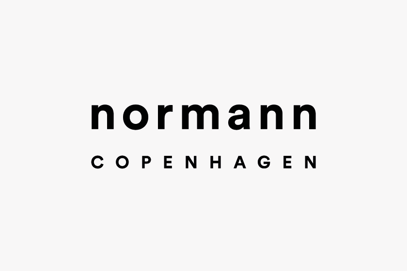 Logo mit dem Text "normann COPENHAGEN" in schwarzer Schrift auf weißem Hintergrund.