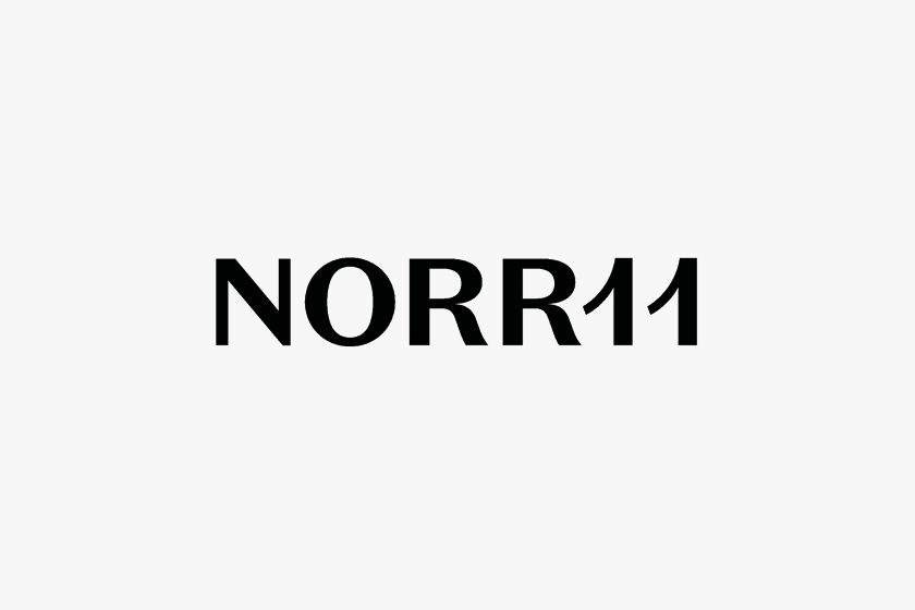 Schwarzer Text 'NORR11' auf weißem Hintergrund.
