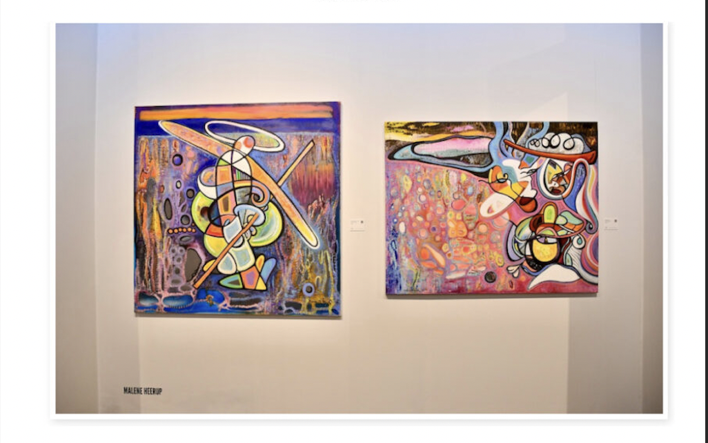 Two colorful abstract paintings displayed on a white gallery wall.