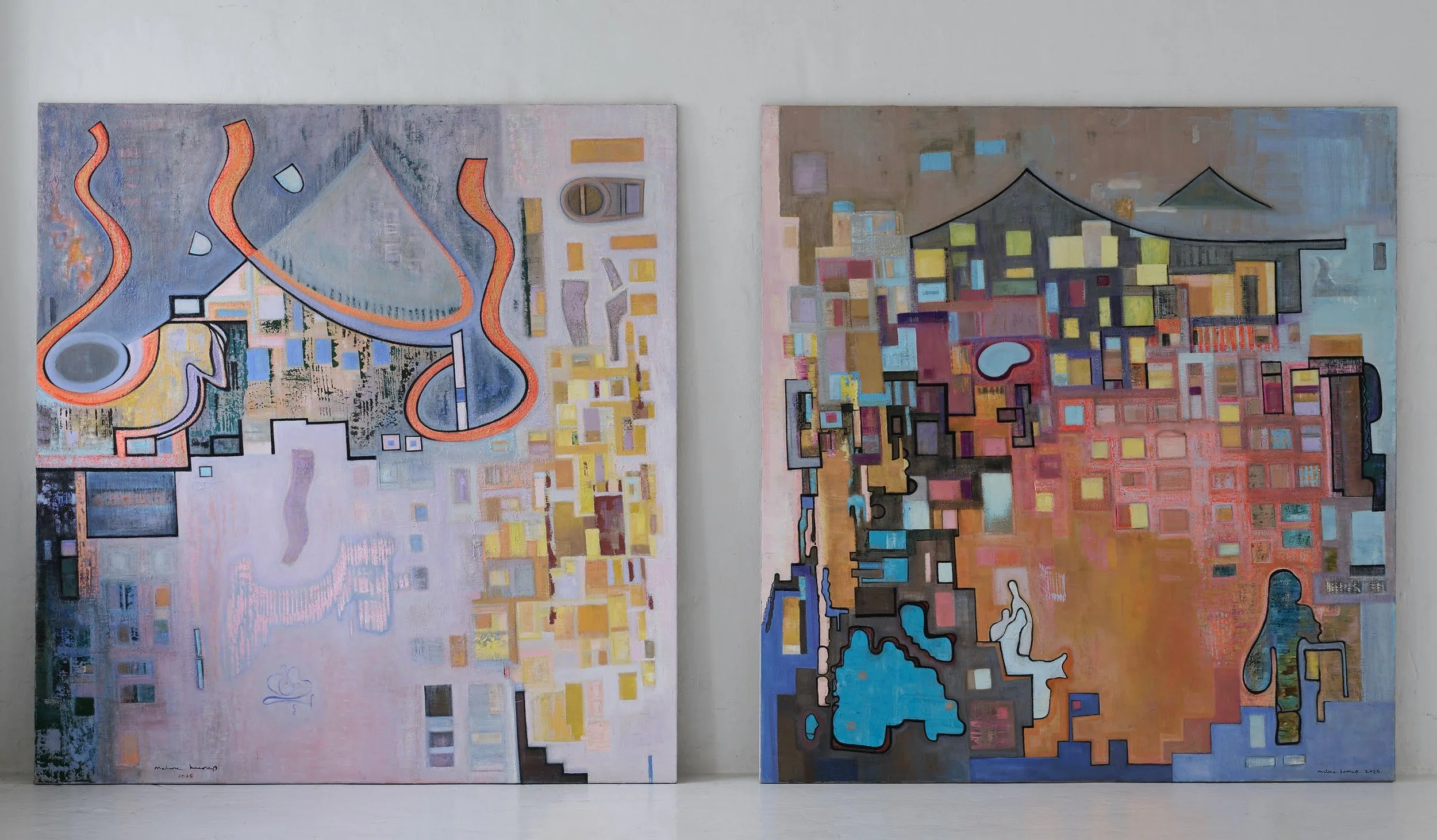 Two colorful abstract paintings with geometric shapes and lines, mounted on a white wall.