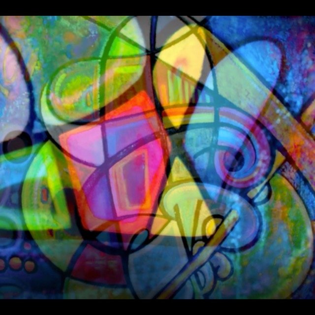Bright, abstract street art with various geometric shapes, vibrant colors, and layered patterns.