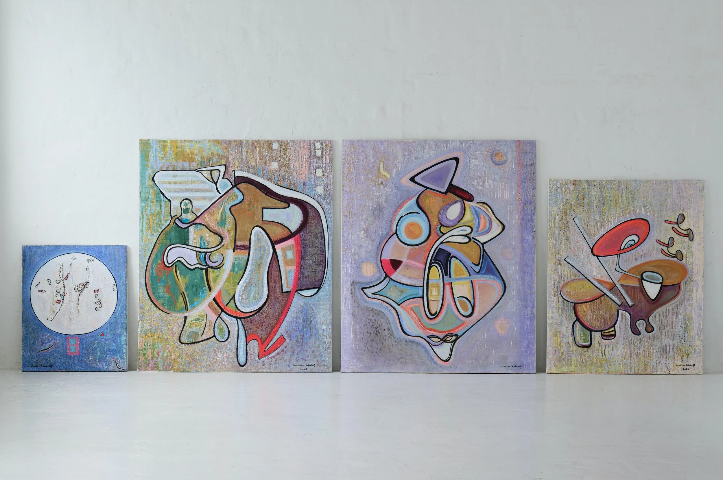 A series of five abstract paintings with vibrant colors and geometric shapes displayed on a white gallery wall.