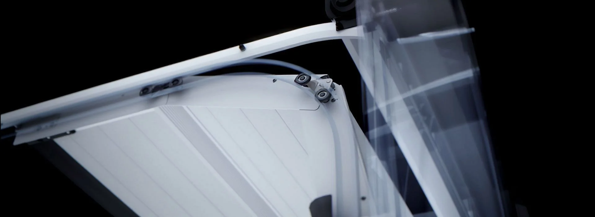Close-up of a modern solar panel angled against a black background.