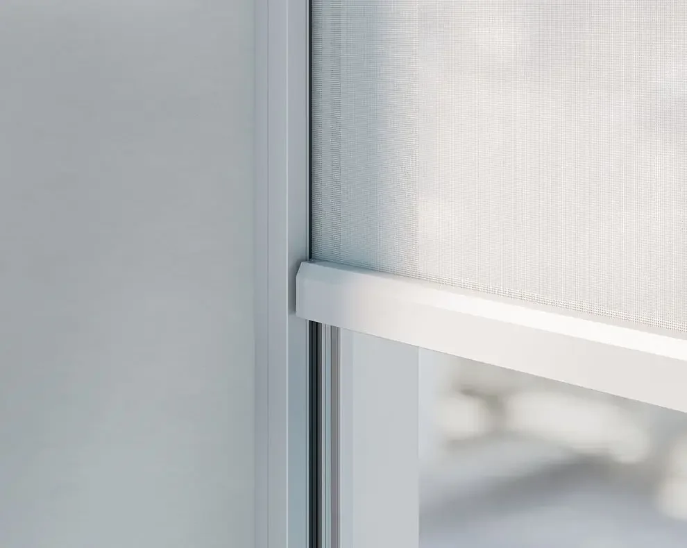 Close-up of a window with a white frame and a mesh screen.