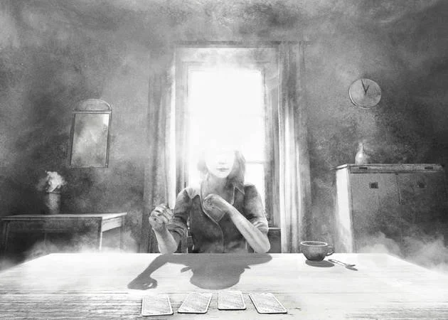 A woman sitting at a table with tarot cards laid out in front of her, holding a card, in a room with a window behind her, a clock on the wall, and various decor items.