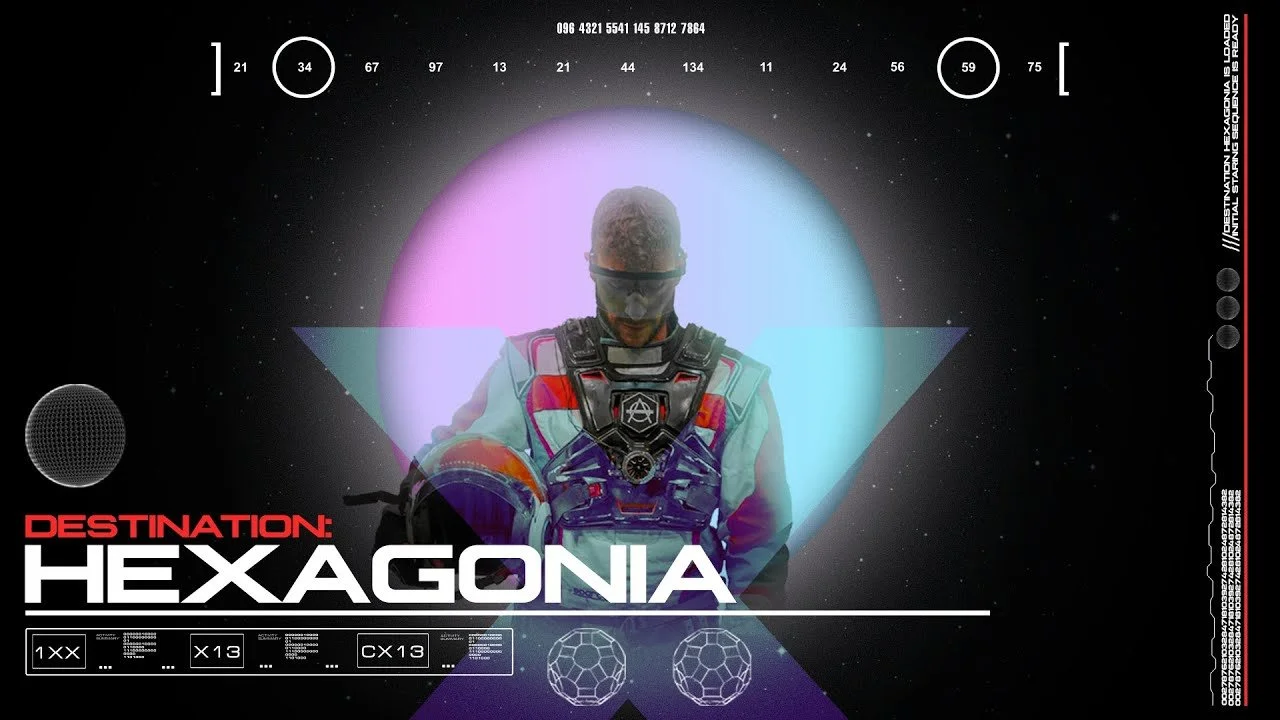 A futuristic space-themed digital graphic featuring a man with a shaved head in astronaut gear and a visor, standing in front of a glowing hexagon shape. The background is black with stars, and the text includes 'Destination: Hexagonia' in bold white and red font, alongside various technical/graphical elements.