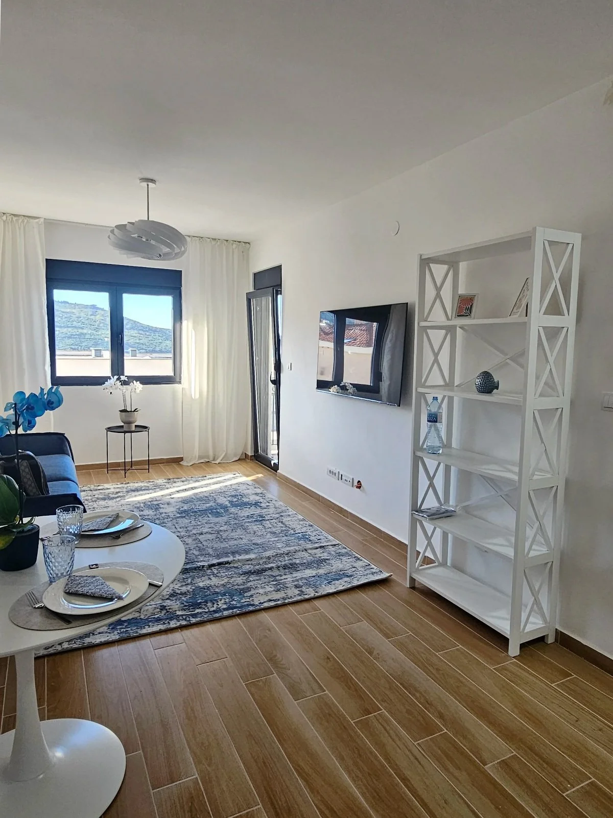 living room with dining zone in apartment in Kumbor