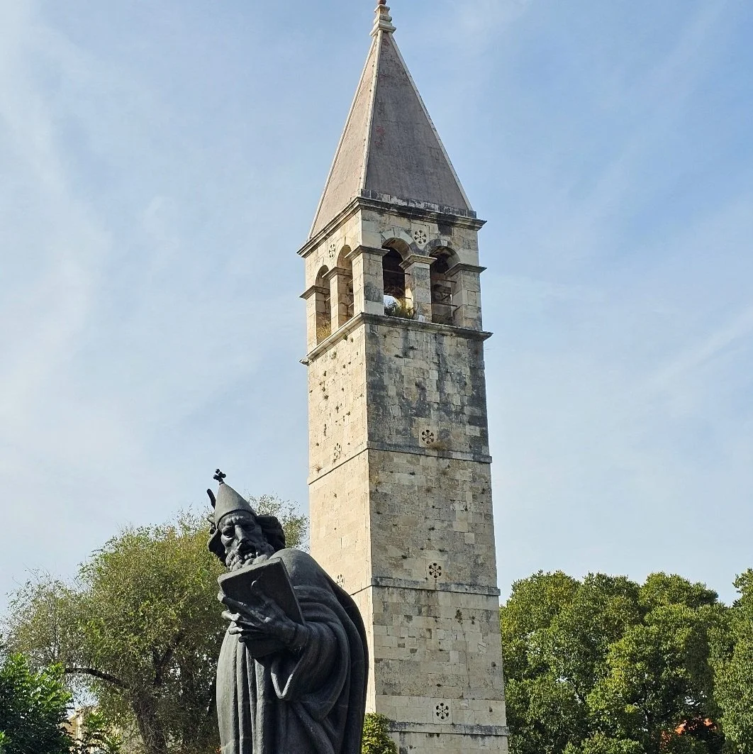 Old town with stone streets, historic tower and traditional atmosphere showing everyday cultural life