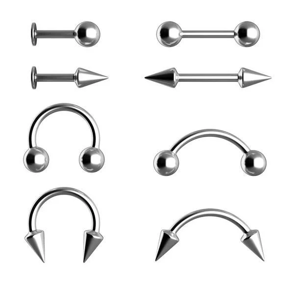 Immagini di vari tipi di piercing in acciaio inossidabile, tra cui punte dritta, punte a cono e cerchi con punte, disposti in due colonne.