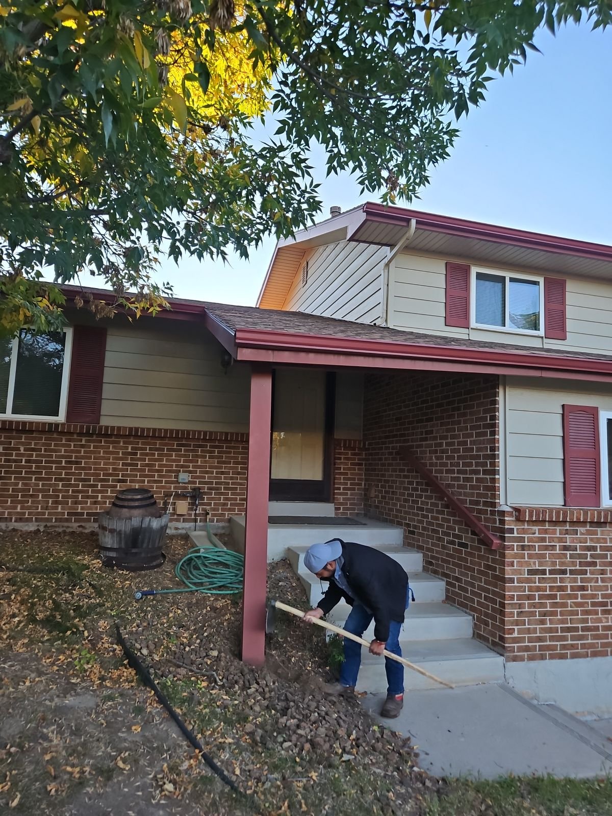 Repairing a tilting porch overhang. The porch roof was sinking due to the post rotting underneath the metal post cover.