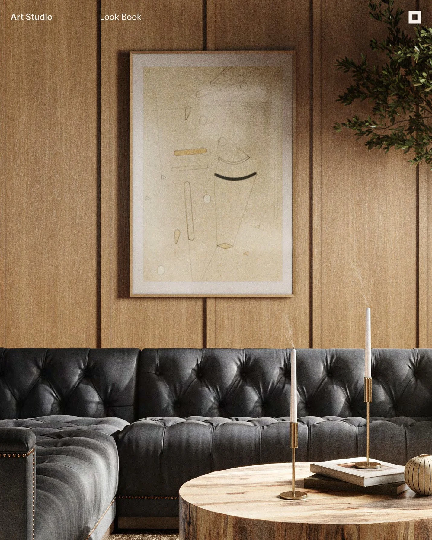 A living room with a black leather tufted sofa, a wooden coffee table with two tall white candles in gold candleholders, a framed abstract art piece on a wood-paneled wall, and a potted green plant in the corner.